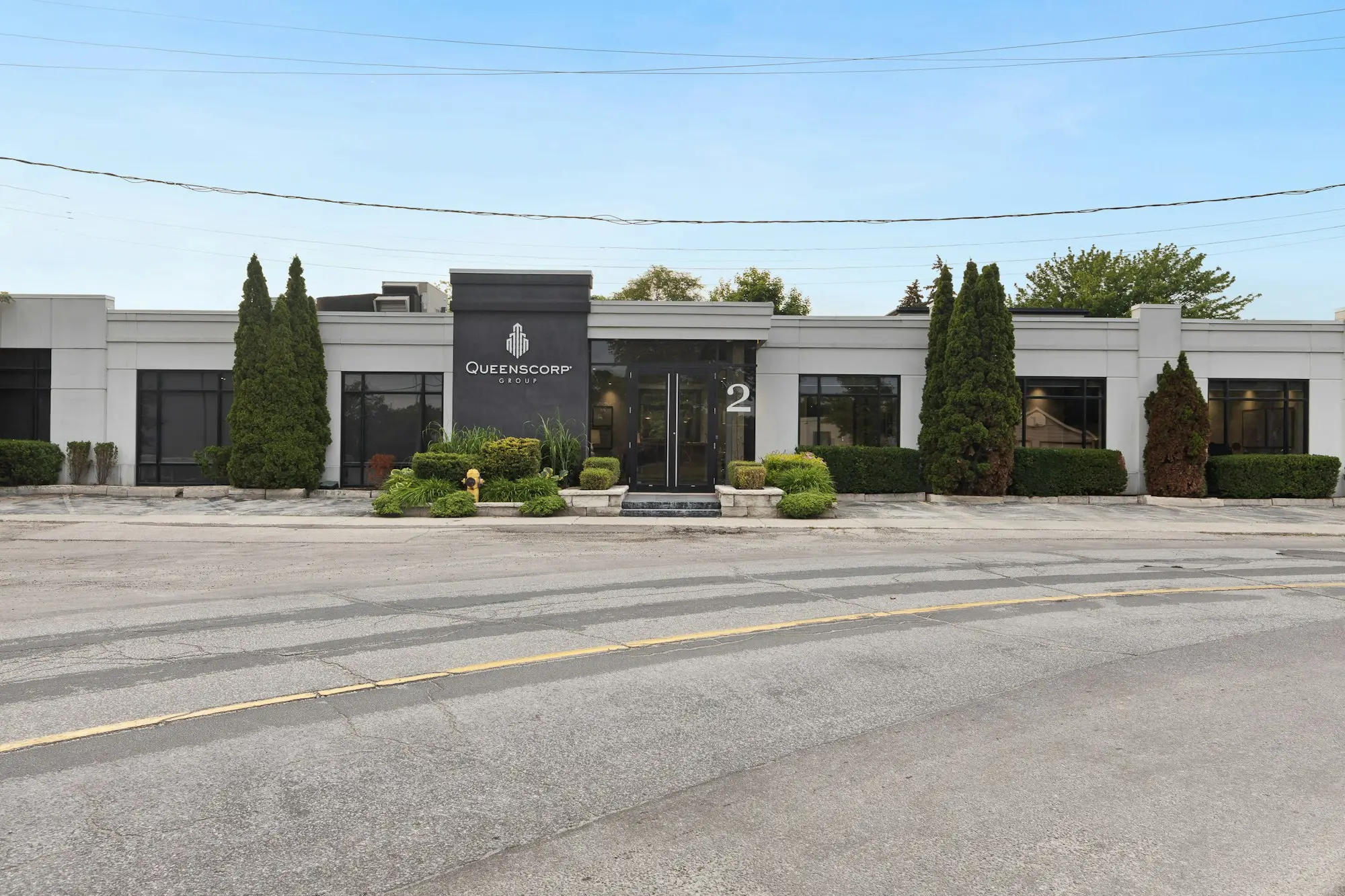 Commercial building with trees growing in front